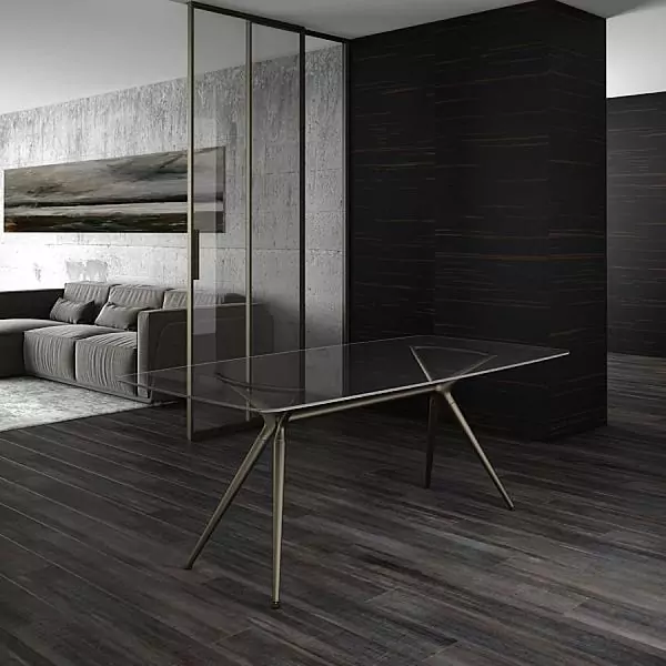 MILAN table. Table top–tempered tinted glass Trasparente Bronzo. Base: aluminum, steel–Soft Bronze finish.