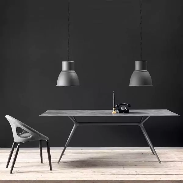 MILAN table. The table top is a universal composite wear–resistant material Marmo Antracite. Base: aluminum, steel – Piombo finish.